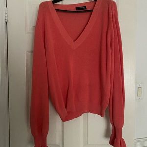 The fifth label. Coral sweater with ruffle detail on sleeve